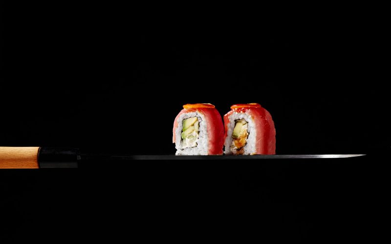 uramaki-rolls-with-tuna-cream-cheese-avocado-kumquat-slices-blade-japanese-sashimi-knife